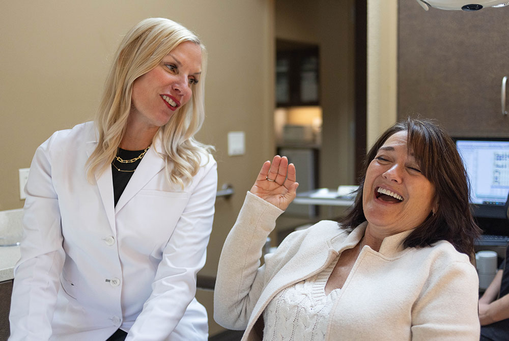 Dr. Jana Gyurina and patient in candid moment at the dental chair